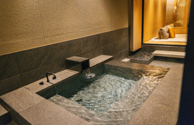 A natural-stone open-air bath